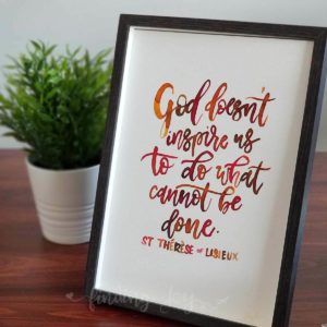 Original, hand-painted brush-lettered artwork of the quote attributed to St Thérèse of Lisieux:  “God doesn't inspire what cannot be done" written in red, burnt orange, brown watercolour on A4 300GSM card. © Joy Adan 2018