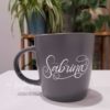 Grey matte personalised/customised mug with "Sabrina" in white, hand-lettered calligraphy